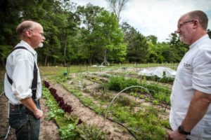 Farmer and Chef talking in the farmer's field