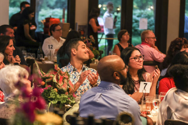 Guests participating in Root to Table's Auction