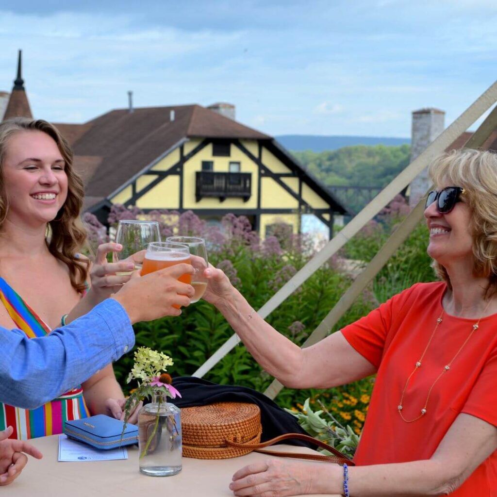 A group of women having drinks outside at the Bavarian Inn.