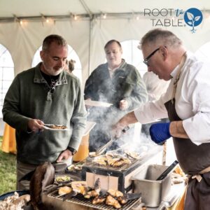 Chef Marcus serving grilled oysters