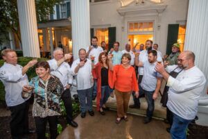 Chefs and Farmers toasting after Root to Table's Pickled & Roasted